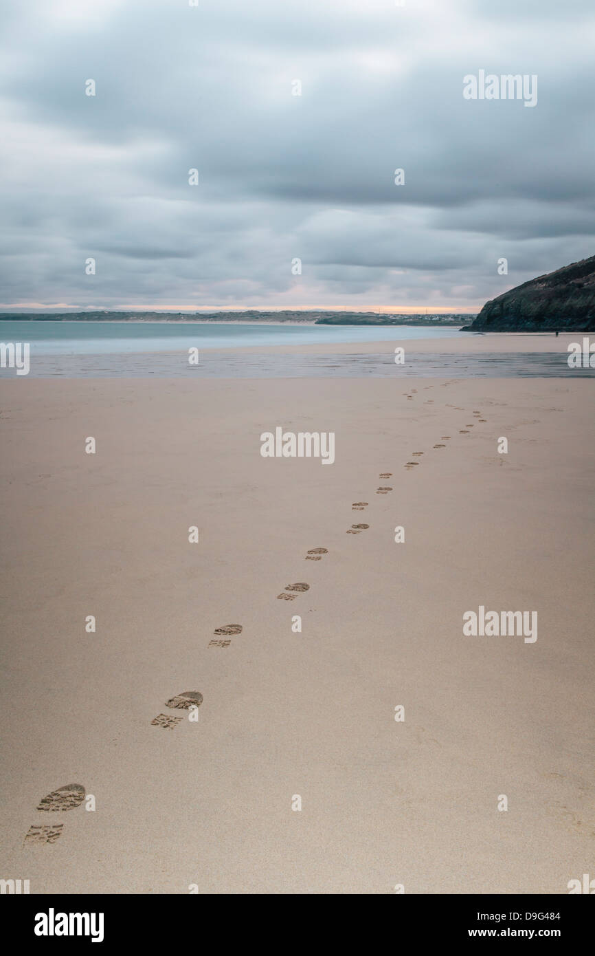 Footsteps in the sand, Carbis Bay beach, St. Ives, Cornwall, England, UK Stock Photo