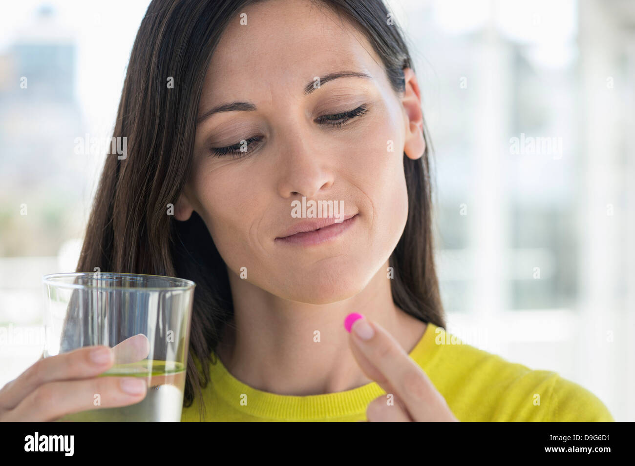 Close-up of a woman taking medicine Stock Photo