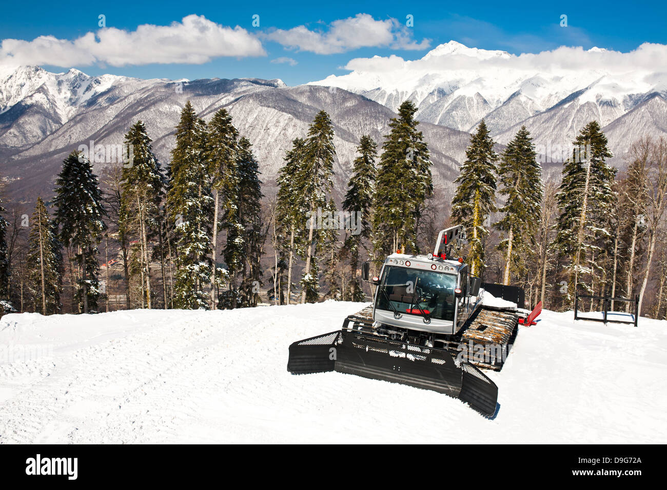Snowplows, mountains on background Stock Photo
