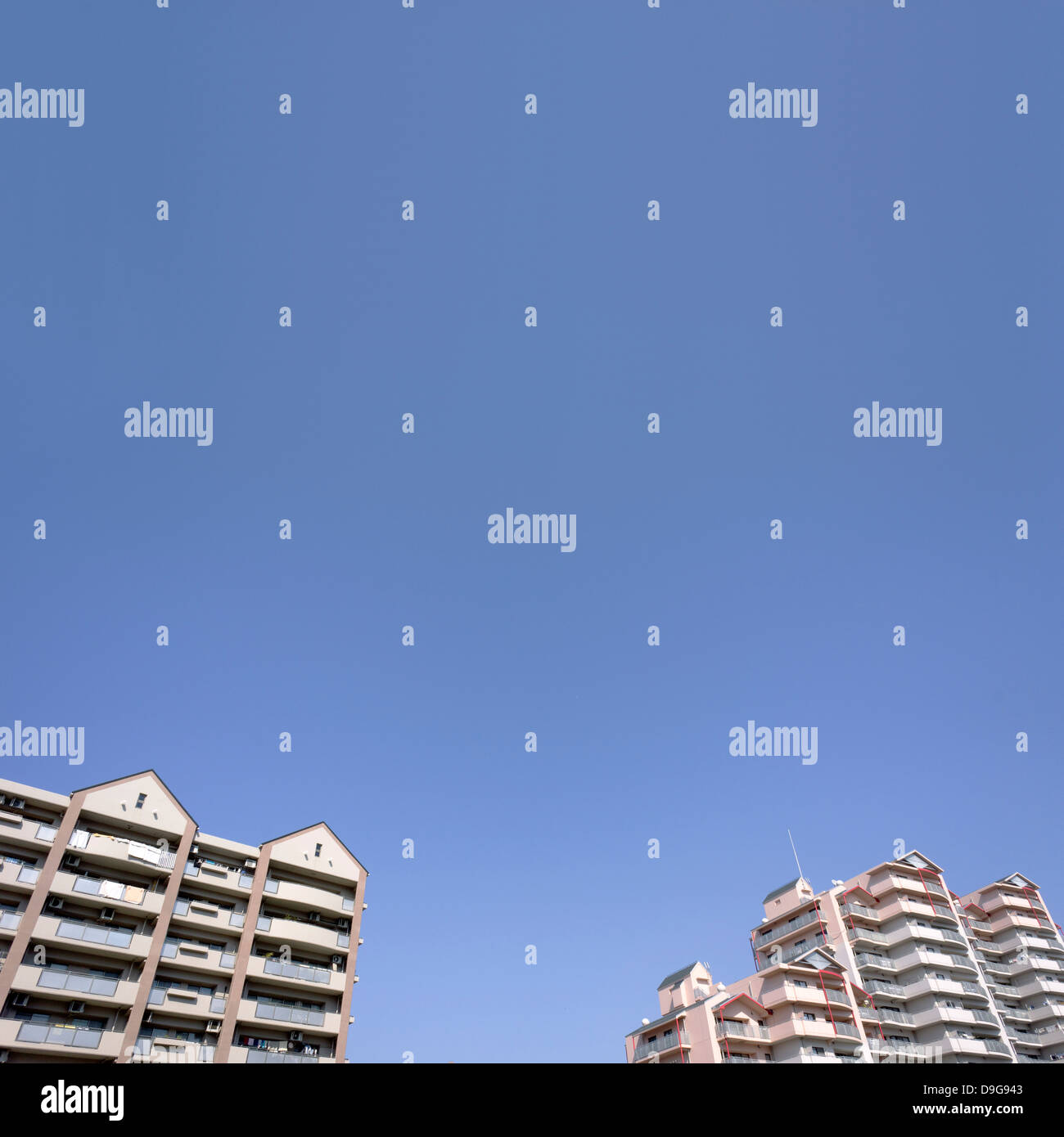 Apartment buildings and blue sky Stock Photo - Alamy