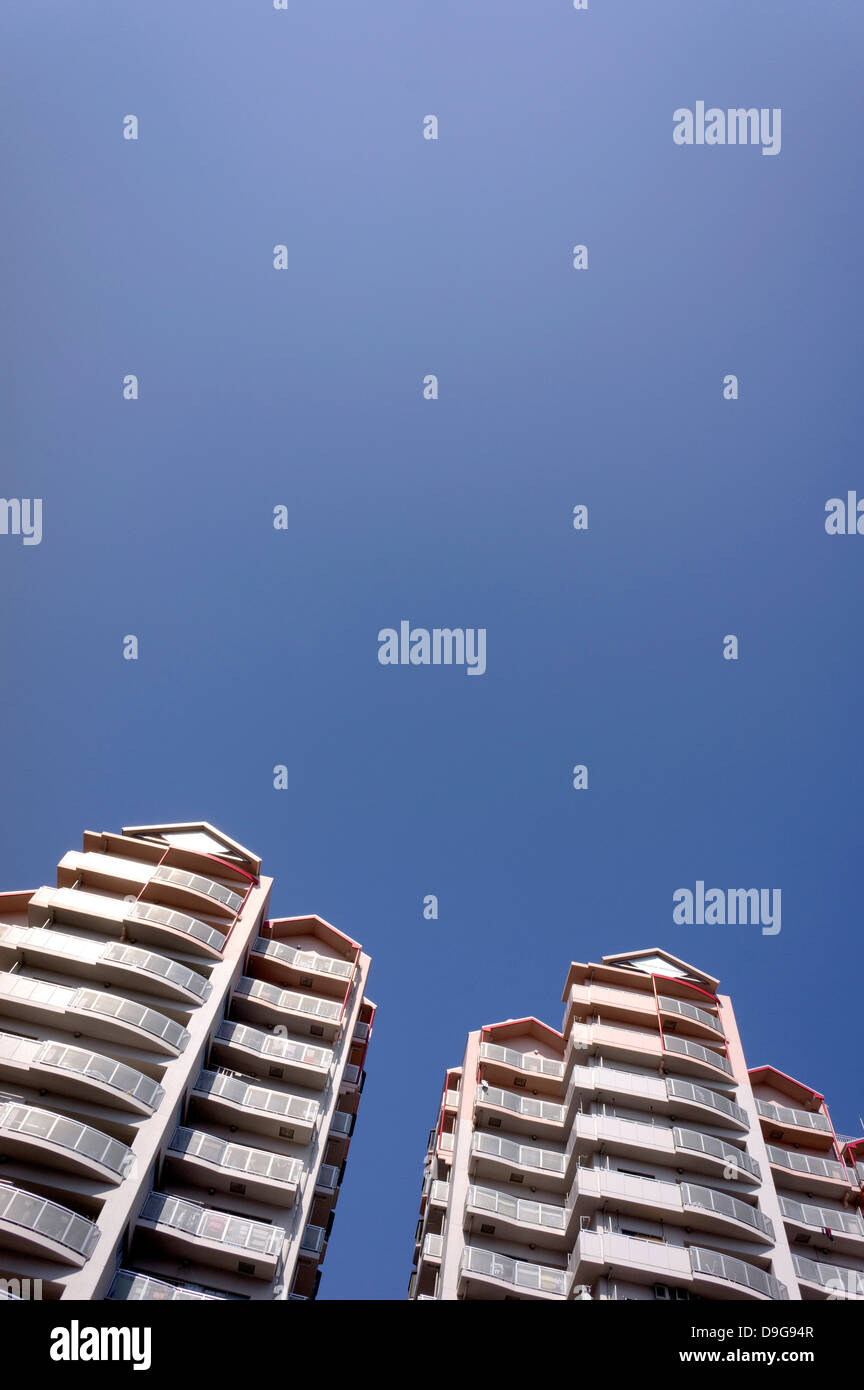 Apartment buildings and blue sky Stock Photo - Alamy