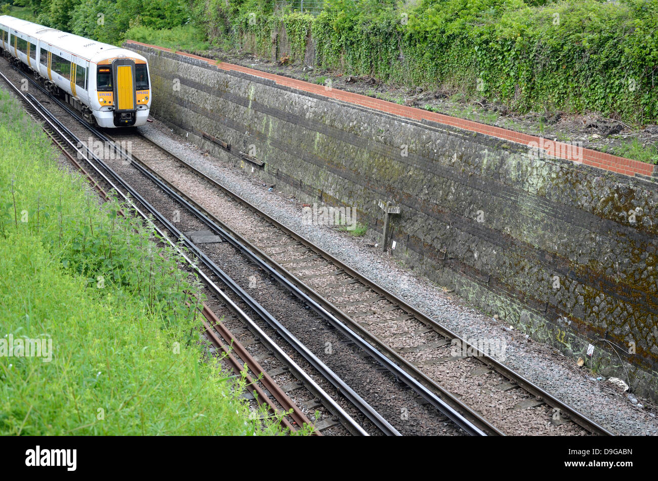 Maidstone, Kent, England. South Eastern train (class 357 'Electrostar') passing through cutting near the town centre Stock Photo