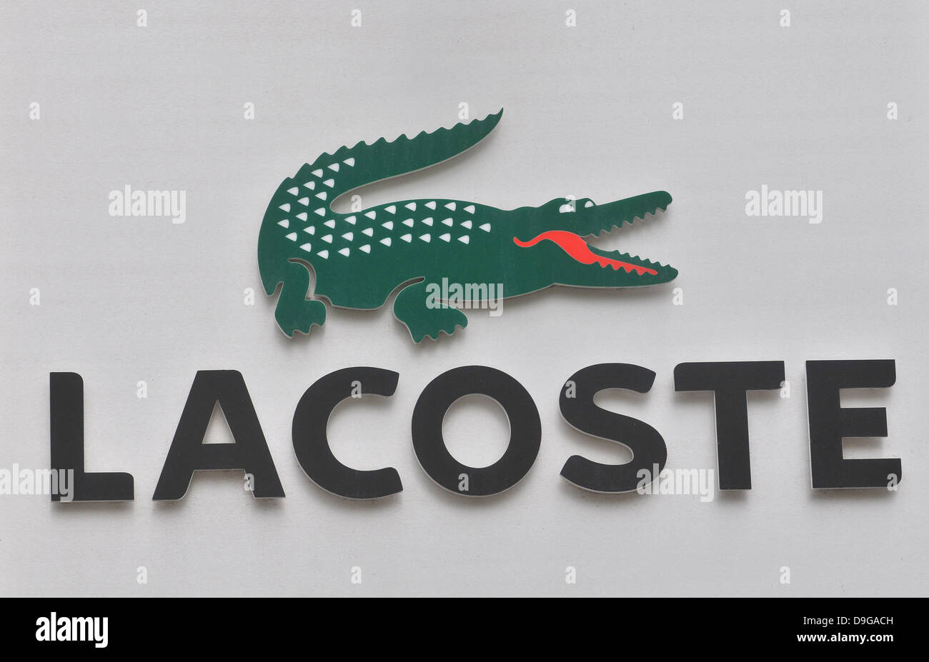 Lacoste logo sign crocodile on facade of store Braga Portugal Stock Photo -  Alamy