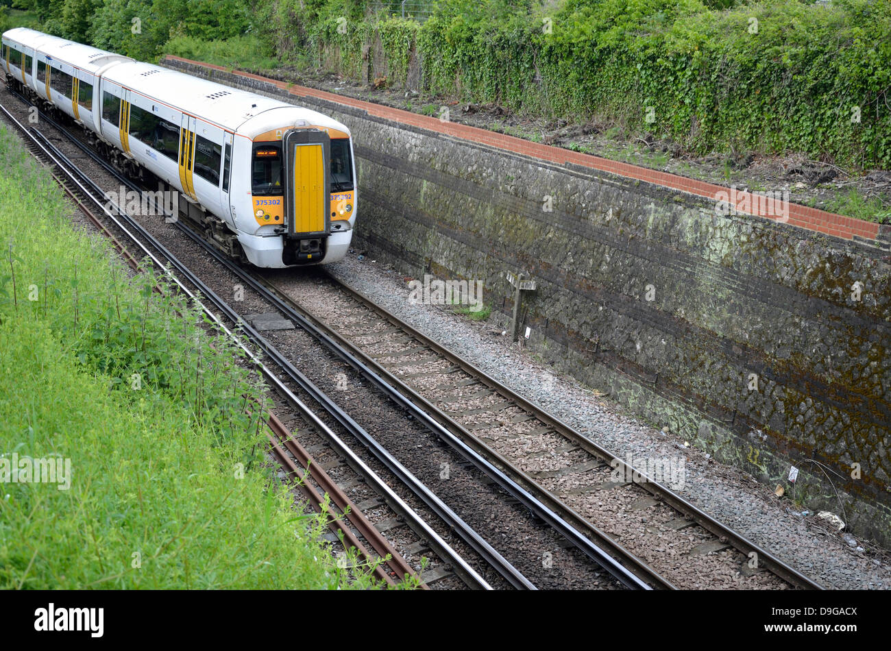 Maidstone, Kent, England. South Eastern train (class 357 'Electrostar') passing through cutting near the town centre Stock Photo