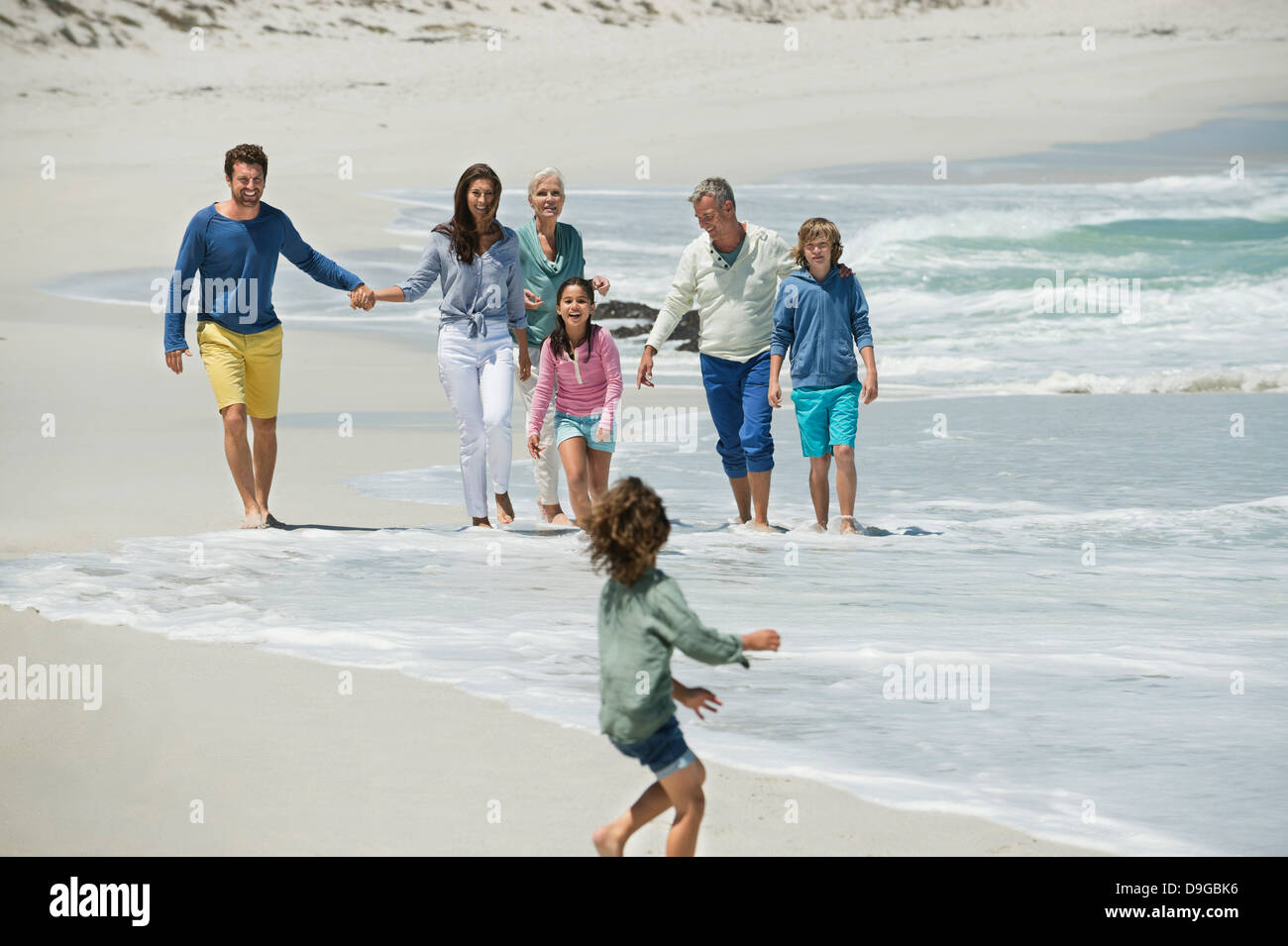 Family enjoying on the beach Stock Photo