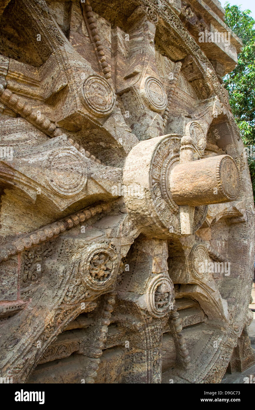 Close up of stone wheel spokes, axle and wedge pin at Sun Temple, Konark, Orissa, India, Asia Stock Photo