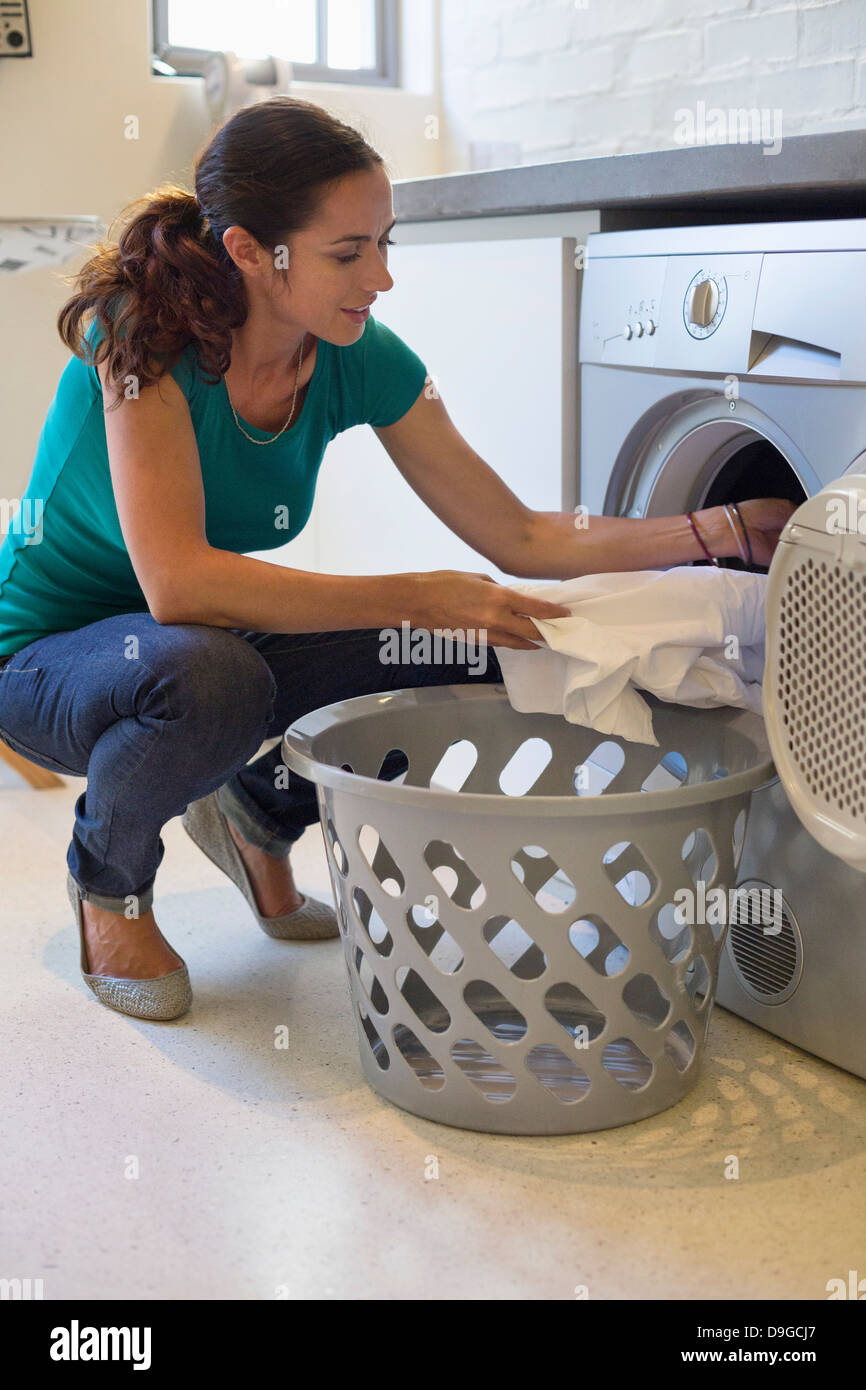 Woman doing laundry at home Stock Photo