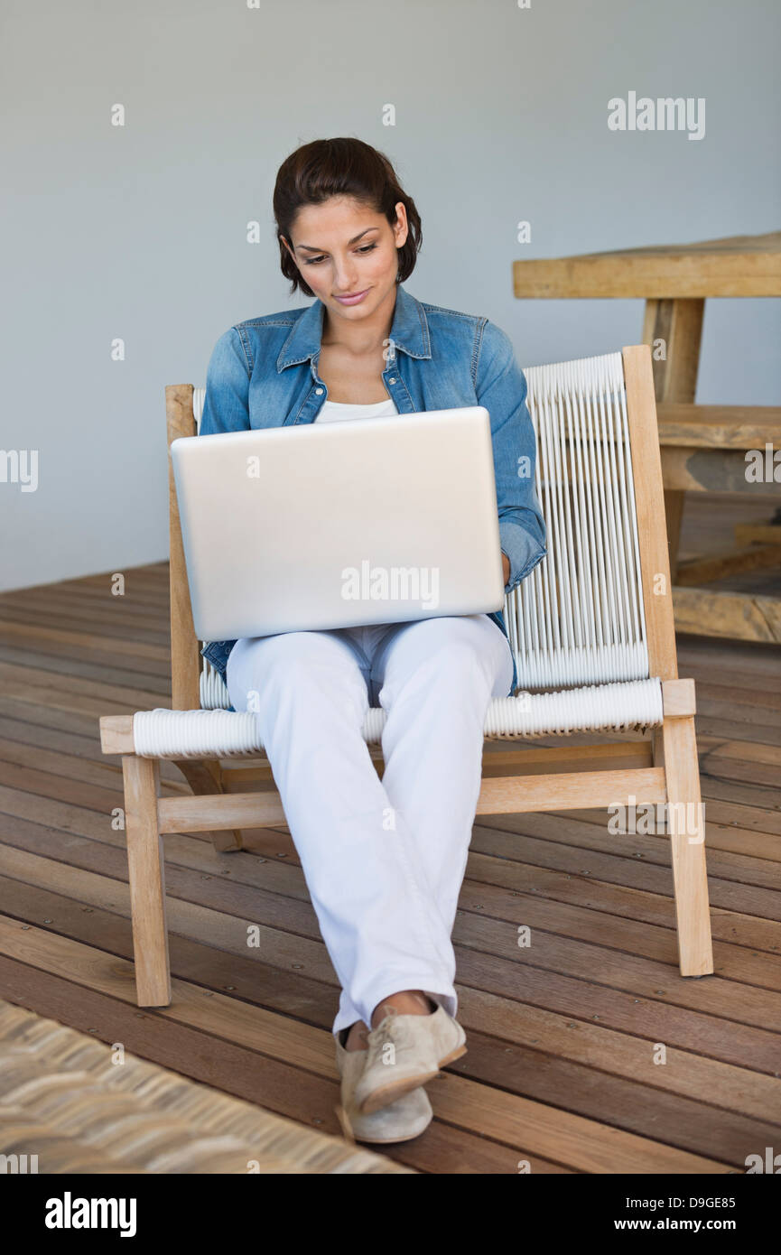 Woman sitting chair full length hi-res stock photography and images - Alamy