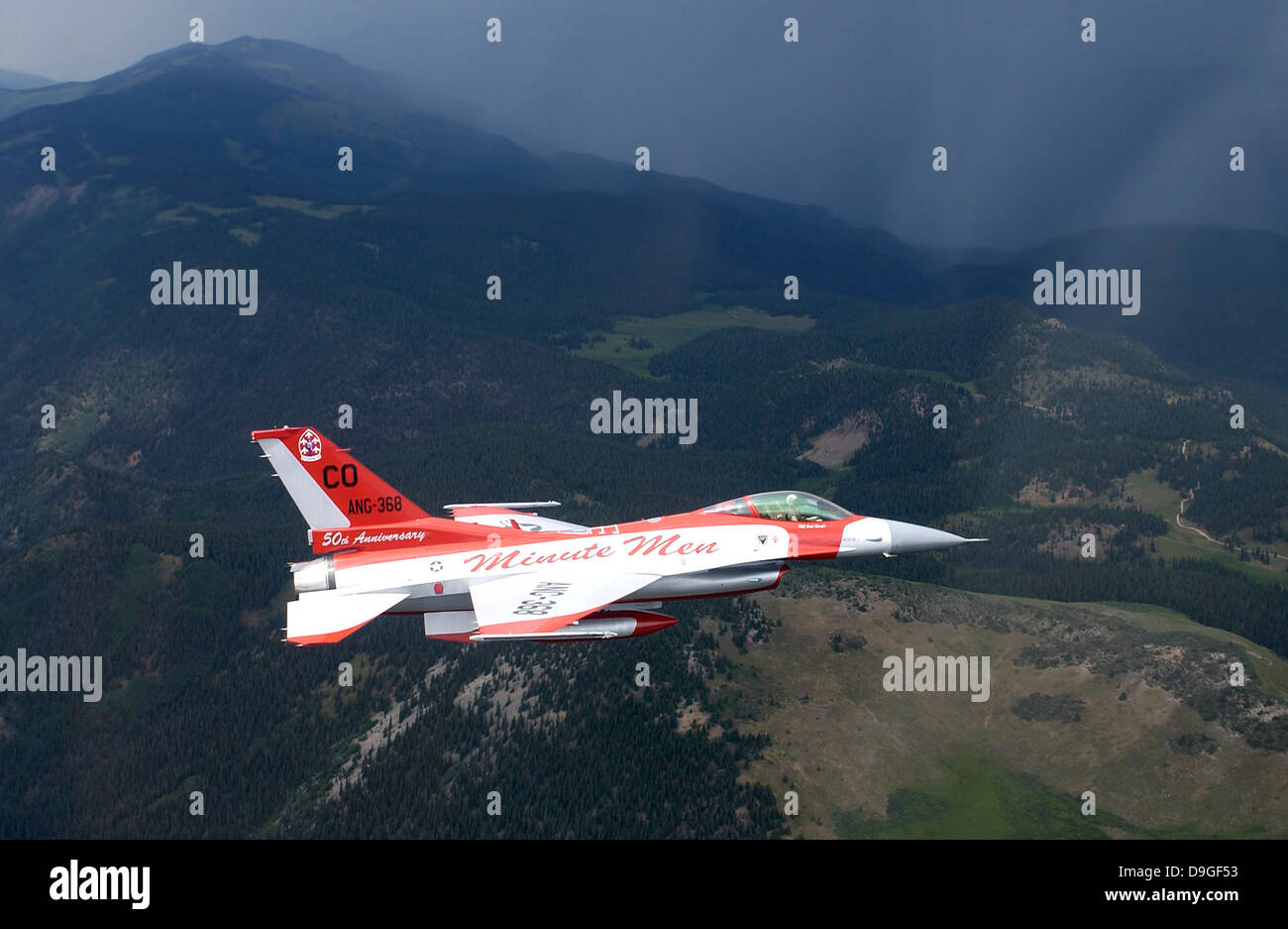 Minute Men paint scheme on an F-16 Fighting Falcon over Rocky Mountains Stock Photo