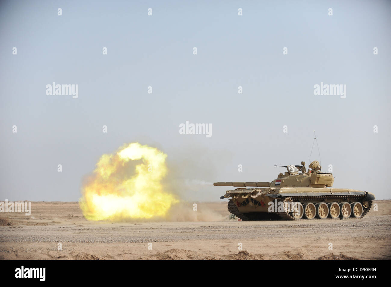 An Iraqi T-72 tank fires at the Besmaya Gunnery Range, Iraq. Stock Photo