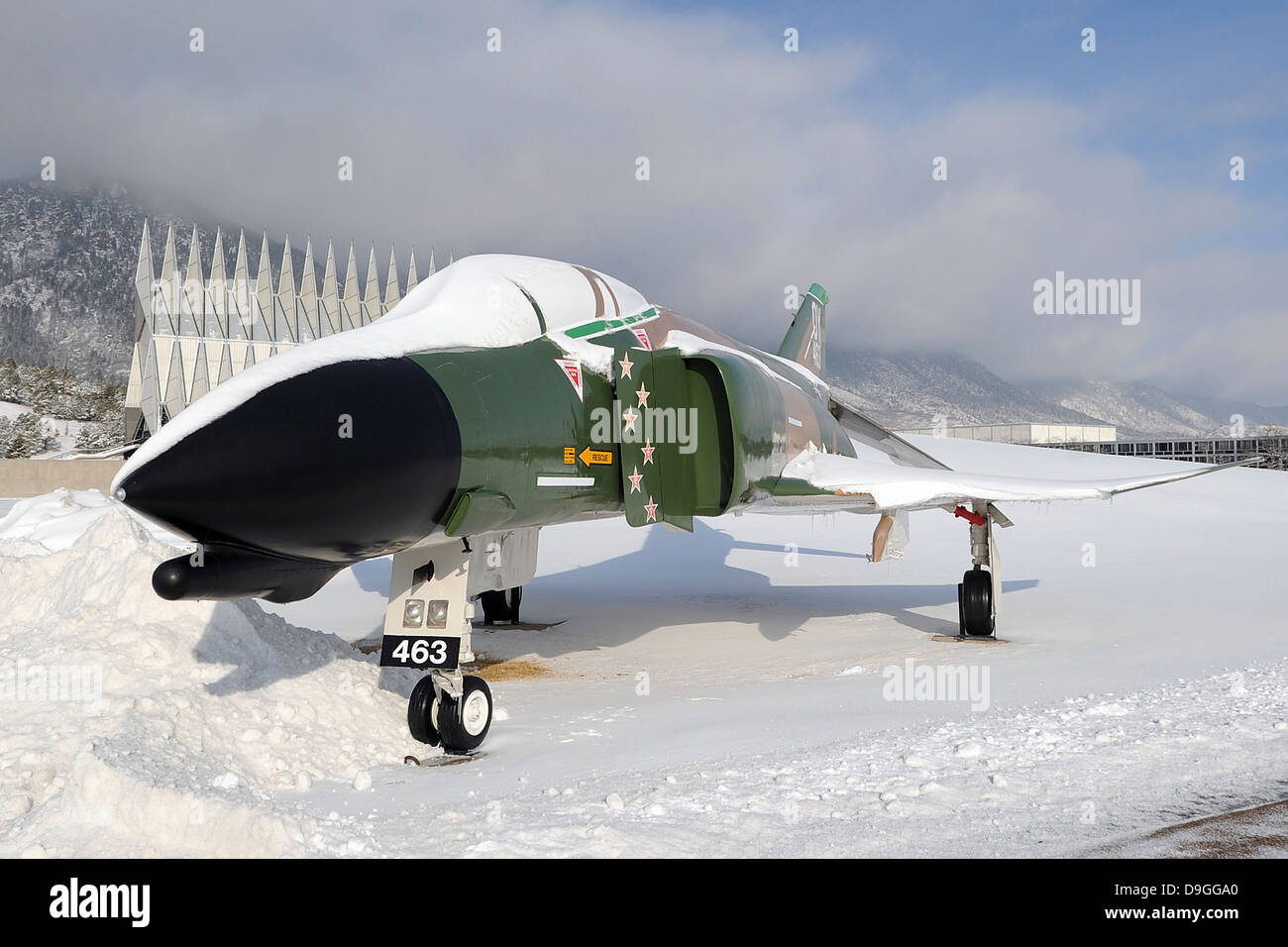 An F-4D Phantom II aircraft static display covered in snow. Stock Photo