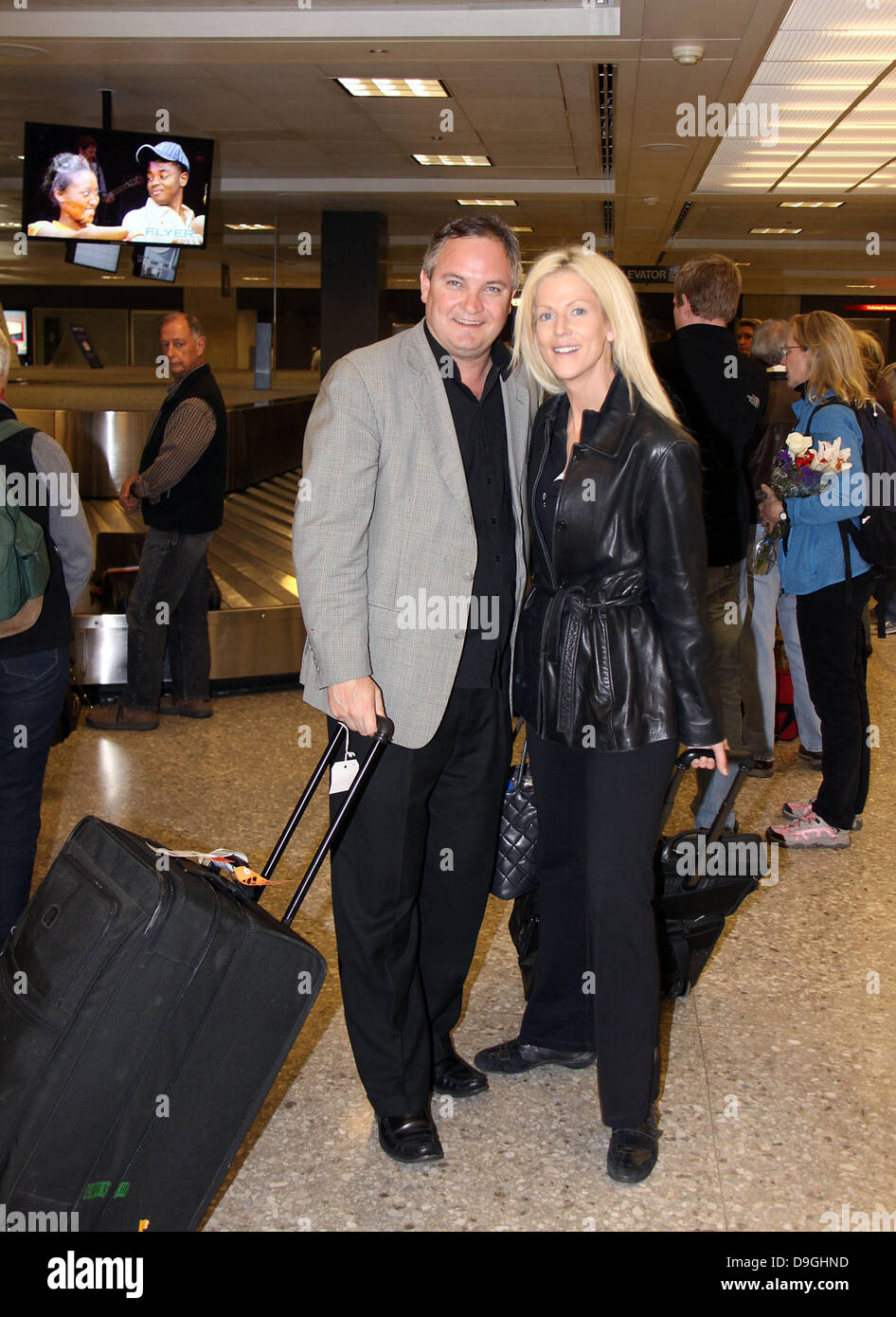 White House Party crashers Tareq Salahi and Michaele Salahi arrive at Washington Dulles Airport  after filming their episode of Celebrity Rehab which Michaeli Salahi has been kicked off the show. Washington DC, USA - 16.03.11 Stock Photo