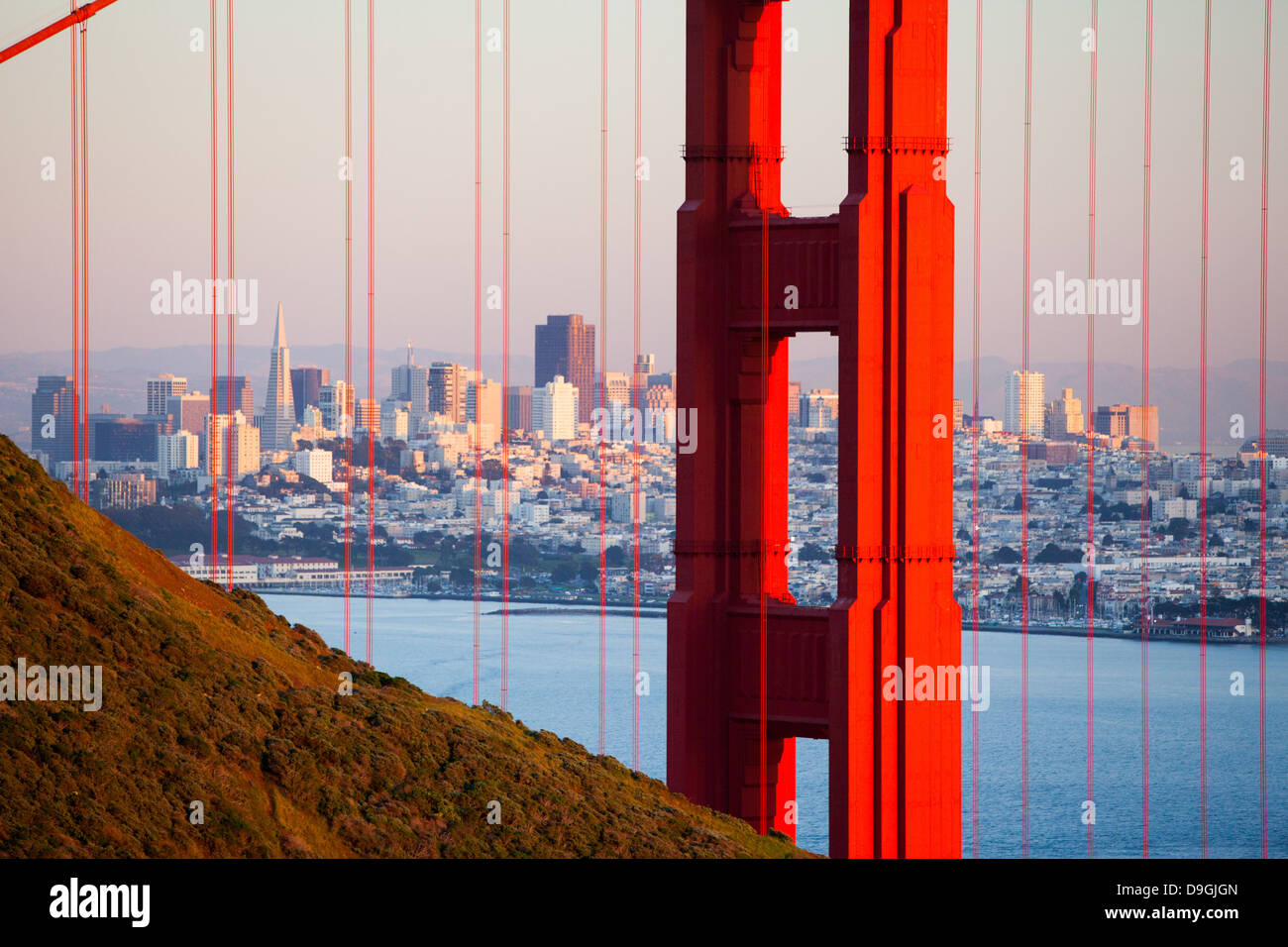 A view at dusk thru the Golden Gate Bridge towards downtown San Francisco. In California, USA. Stock Photo