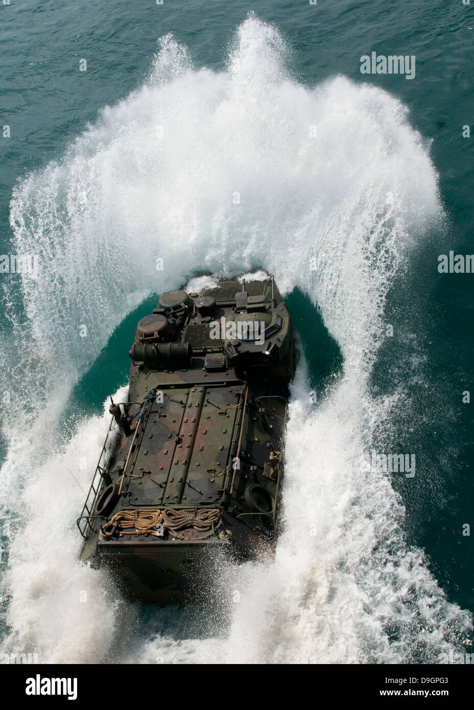 U.S. Marines drive an assault amphibious vehicle in the Pacific Ocean. Stock Photo