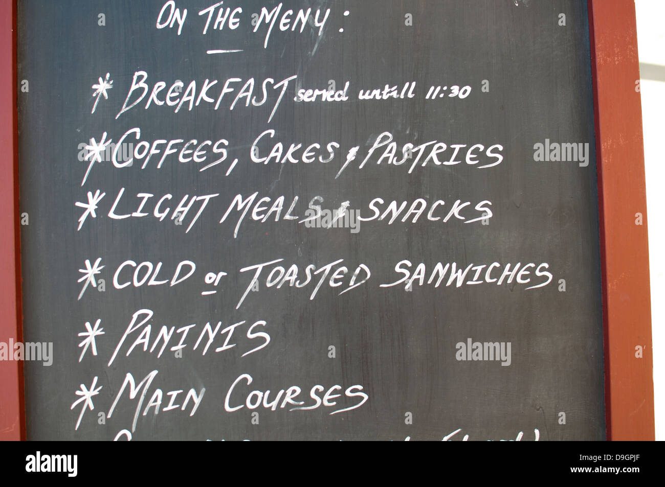 Spelling mistakes on cafe board, sanwiches instead of sandwiches, untill instead of until Stock Photo