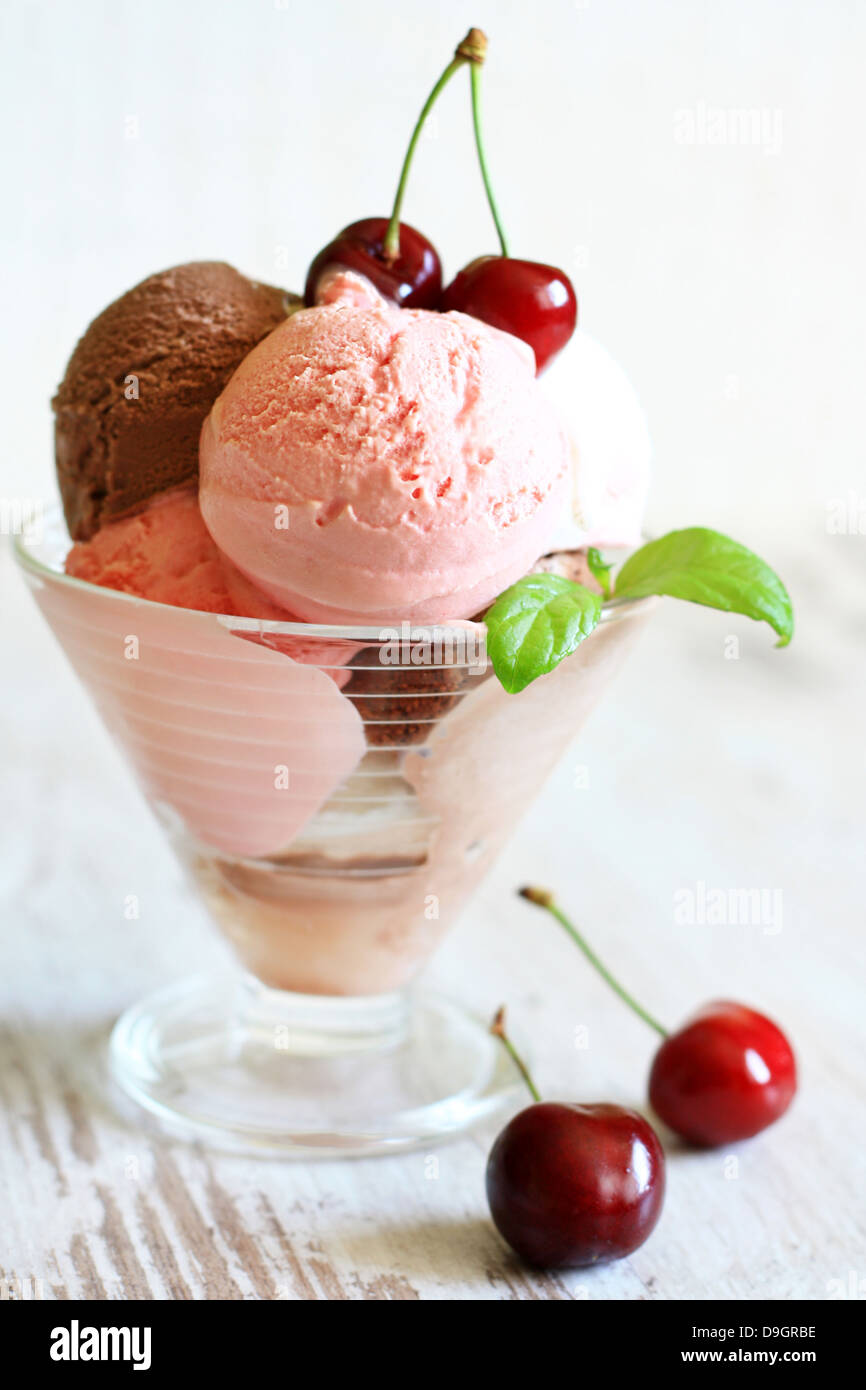 Cherry ice cream on white planks in restaurant Stock Photo