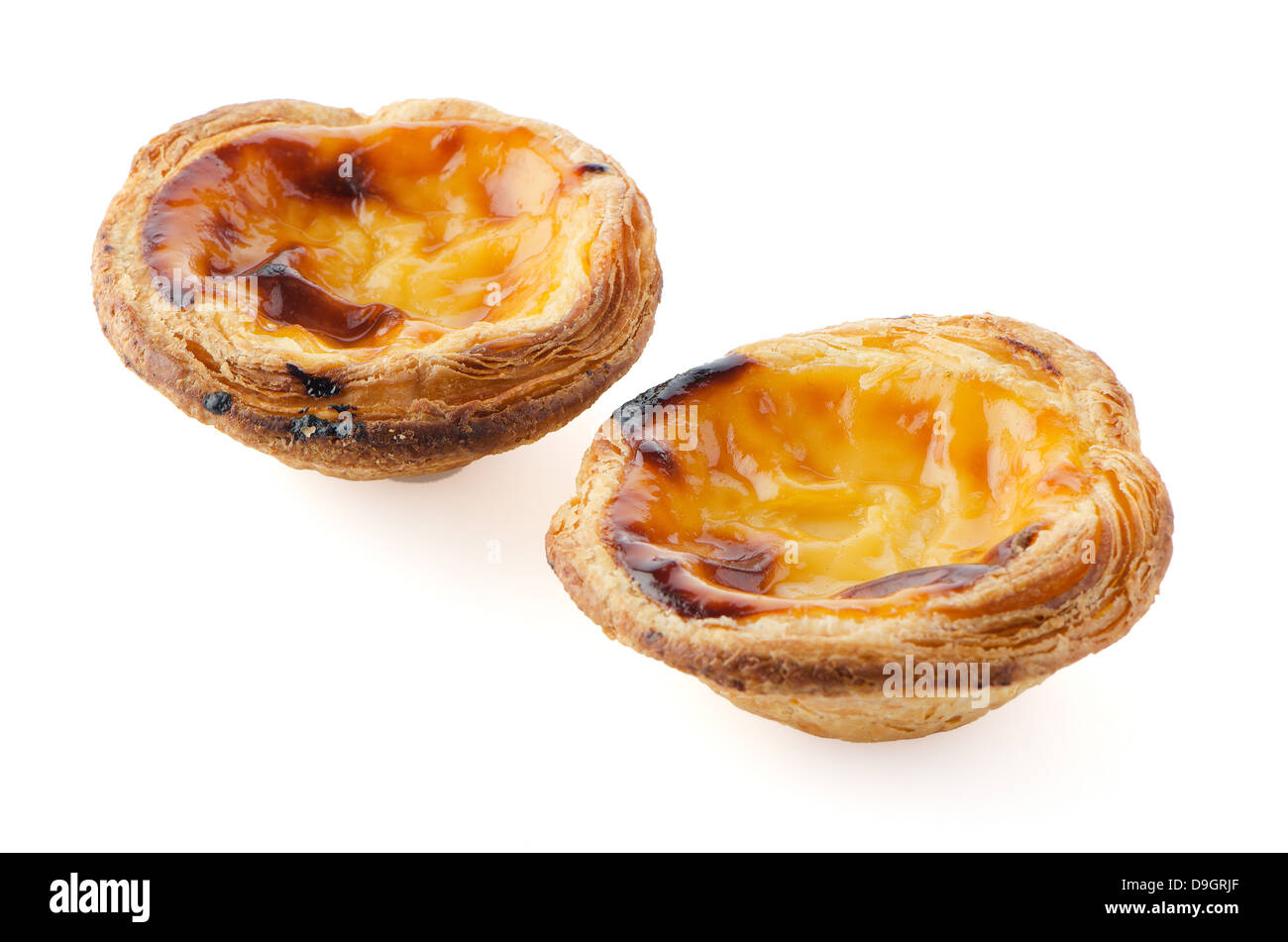 Pasteis de nata, typical pastry from Lisbon - Portugal, isolated on white background. Stock Photo
