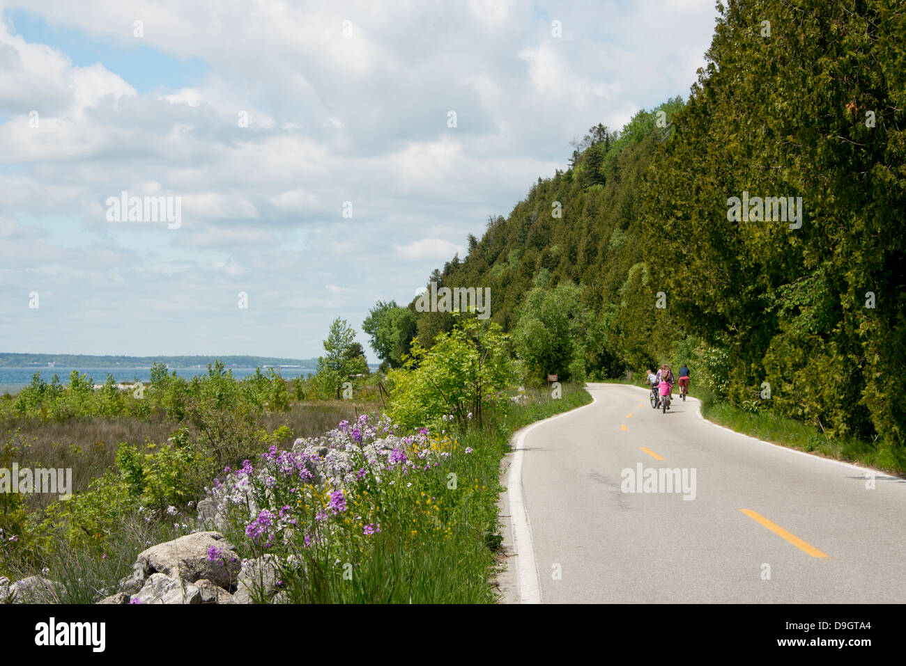 Michigan, Mackinac. Mackinac Island State Park. Exploring the island along Lake Shore Road by bicycle. Stock Photo