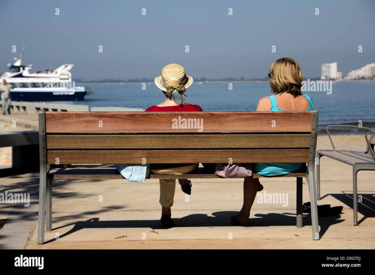 Two Adult Females enjoying the view out to sea Stock Photo