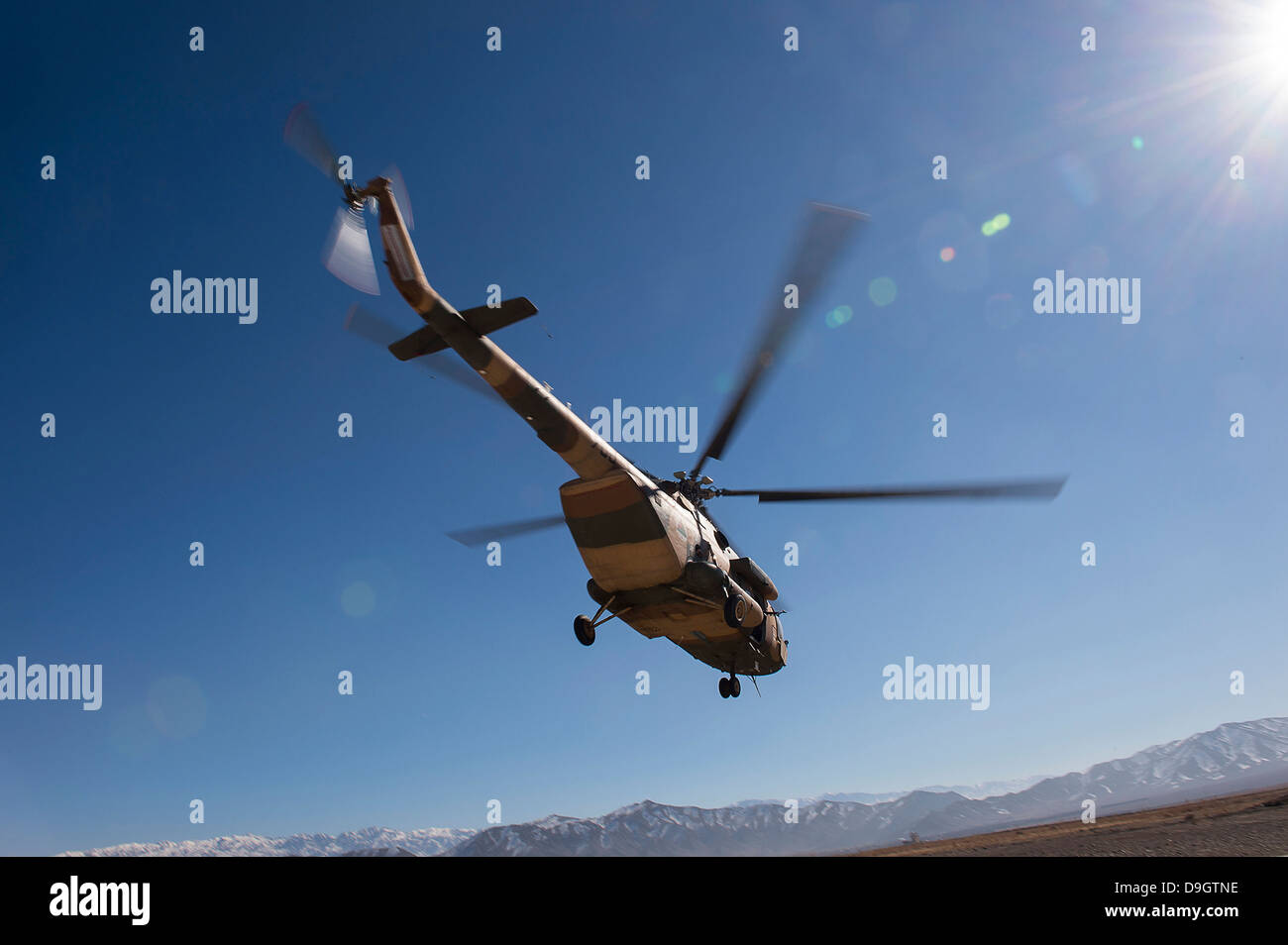 An Afghan Air Force Mil Mi-17 helicopter over Afghanistan. Stock Photo