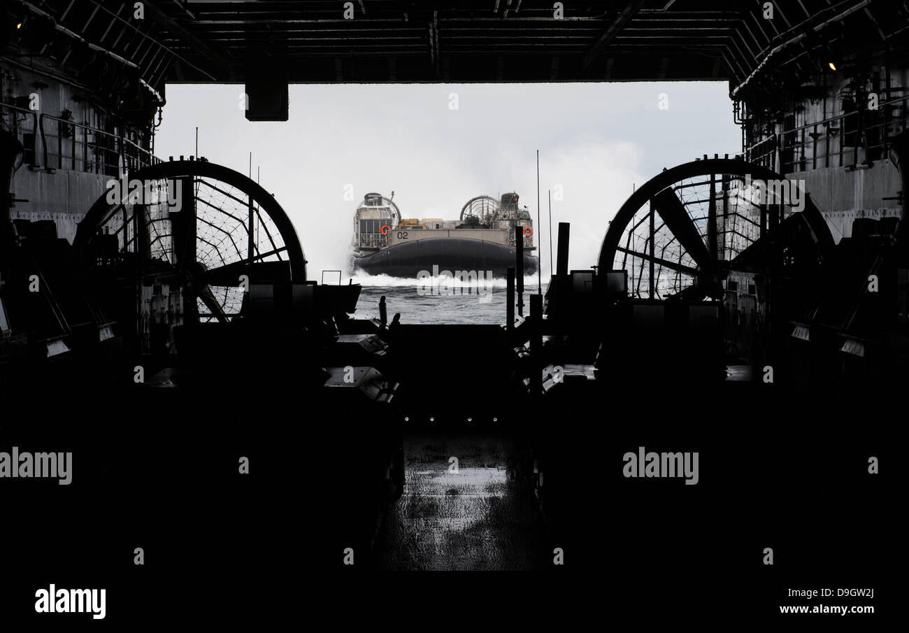 Landing Craft Air Cushion approaches the well deck of USS San Antonio. Stock Photo