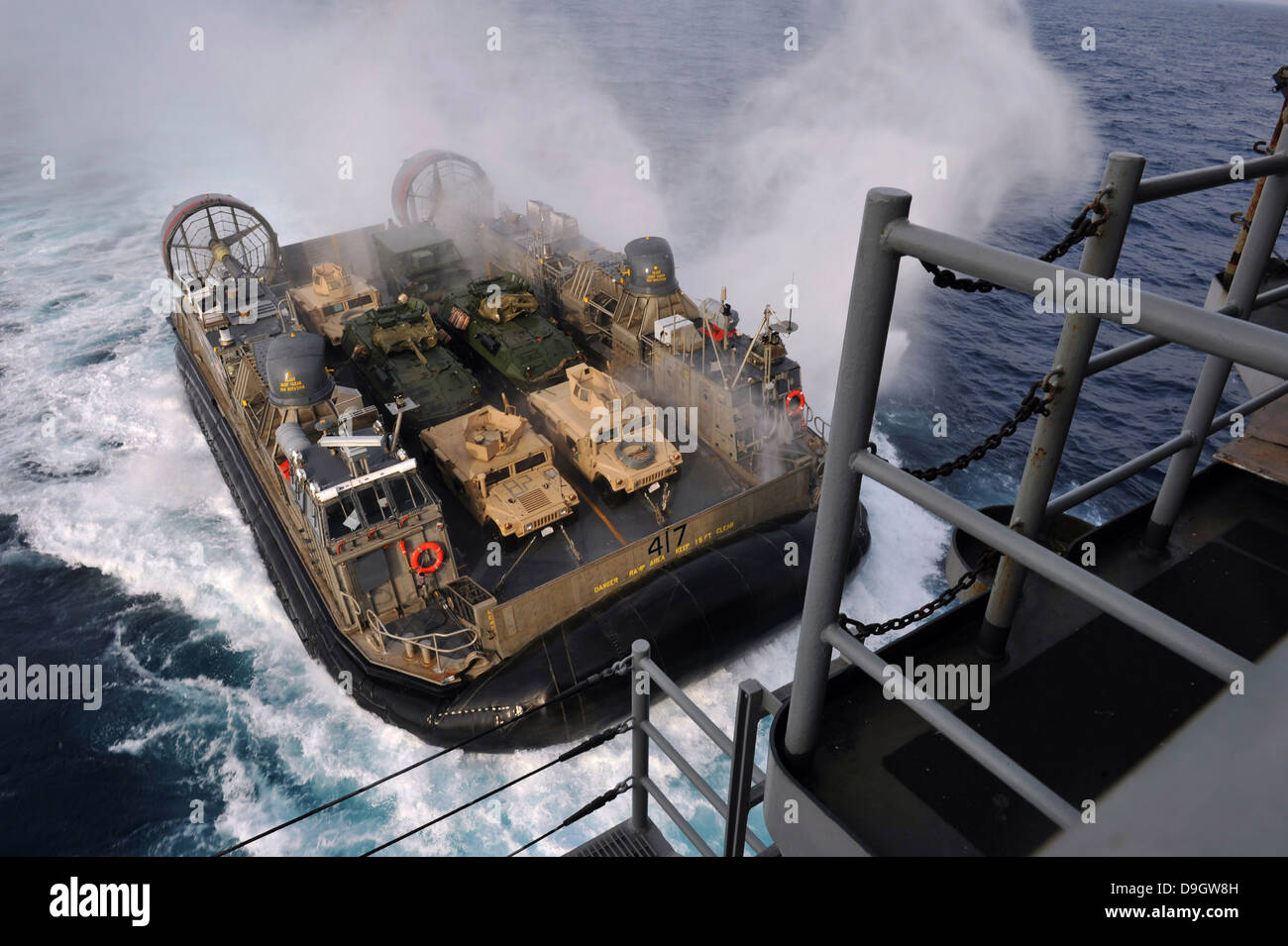 Landing Craft Air Cushion approaches the well deck of USS Bonhomme Richard. Stock Photo