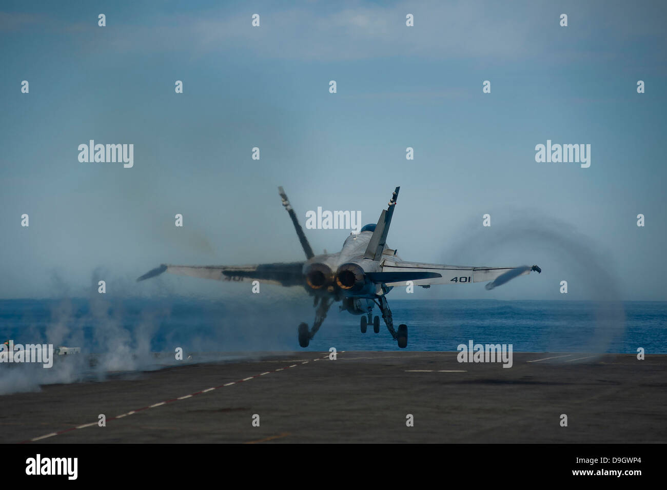 Pacific Ocean, February 16, 2013 - An F/A-18C Hornet launches from the flight deck of the aircraft carrier USS Carl Vinson. Stock Photo