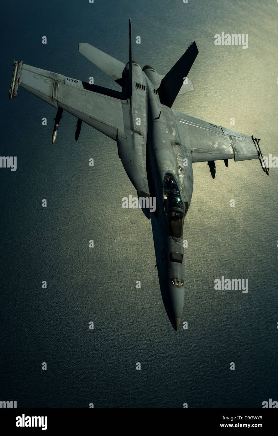 A U.S. Navy F/A-18E Hornet over Southwest Asia. Stock Photo