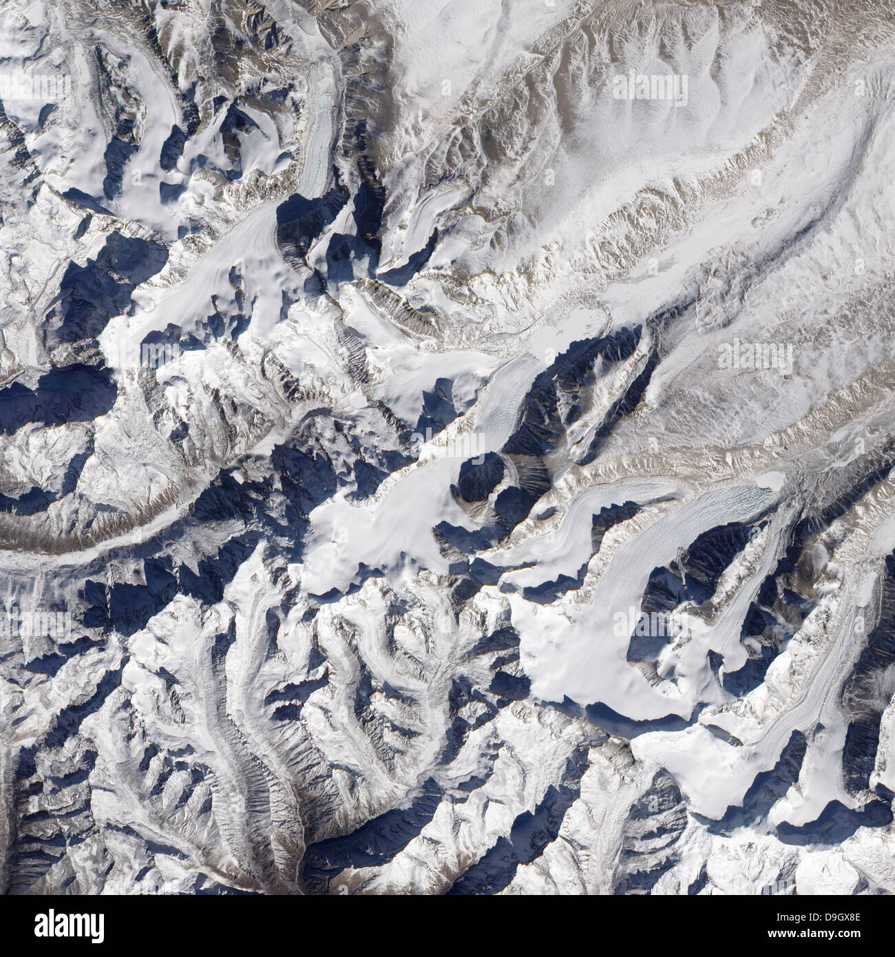 Satellite view of a Himalayan glacier surrounded by mountains. Stock Photo