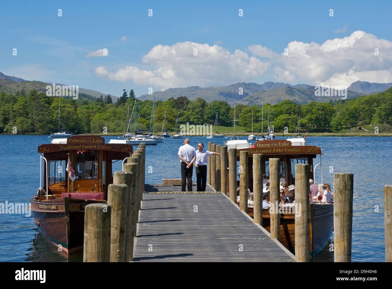 Employees of Windermere Lake Cruises and passenger boats Stock Photo