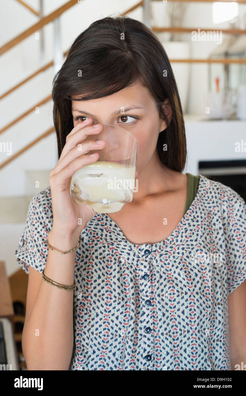 Woman drinking a glass of juice Stock Photo