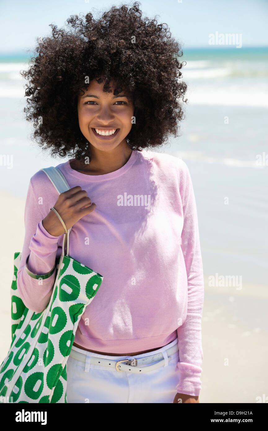 Portrait of a woman smiling on the beach Stock Photo - Alamy