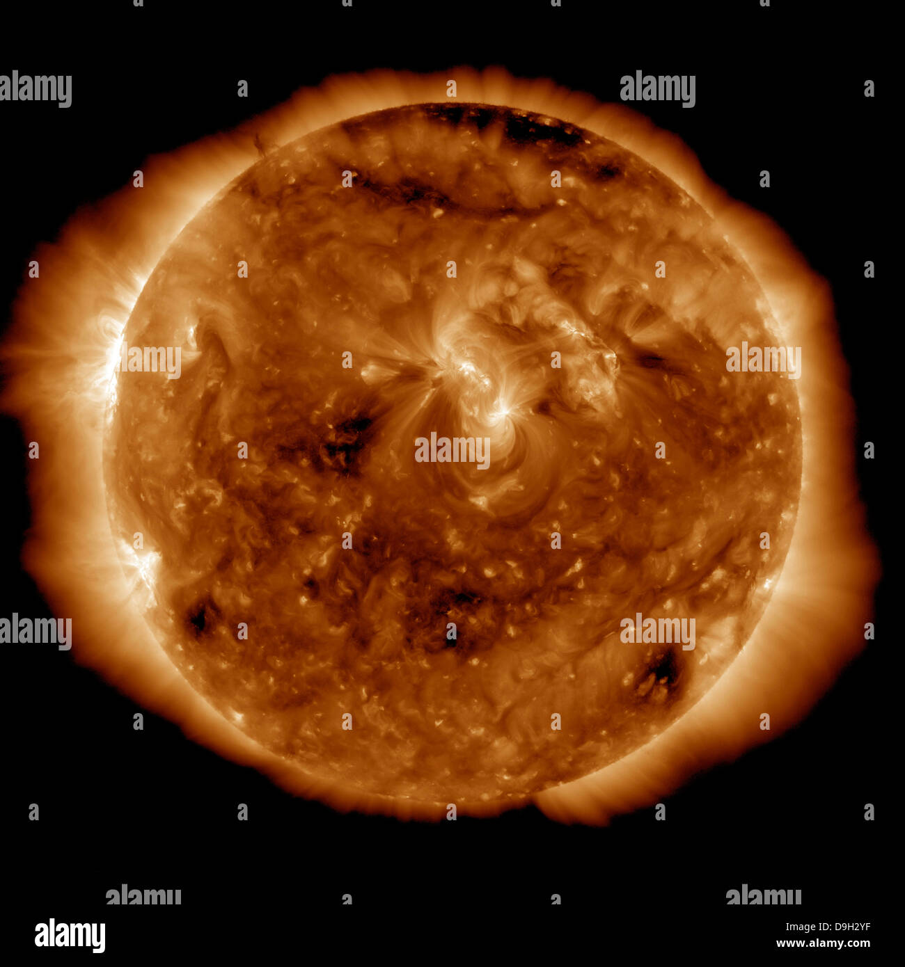 A dark rift in the sun's atmosphere known as a coronal hole. Stock Photo