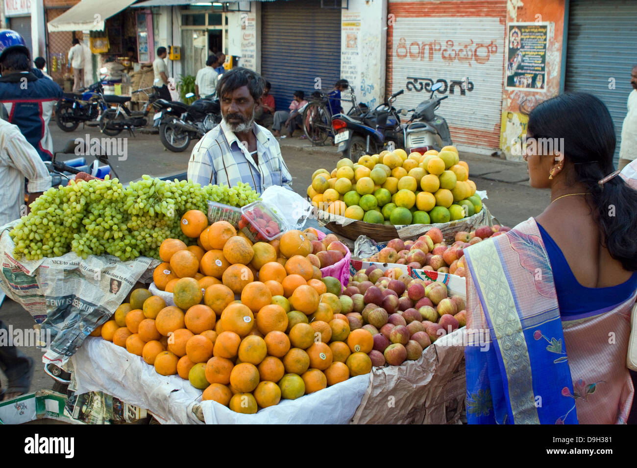 Asia, India, Karnataka, Mysore, fruiterer in his market stall Stock ...