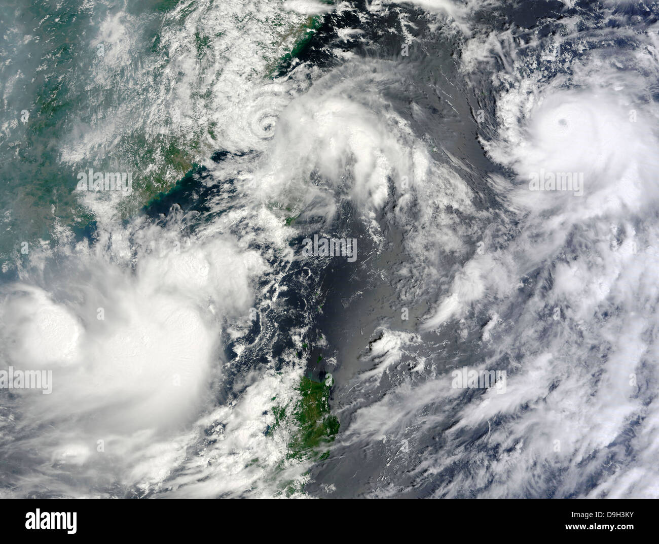 Three strong storms churn in the Pacific Ocean Basin off the Asian coast. Stock Photo