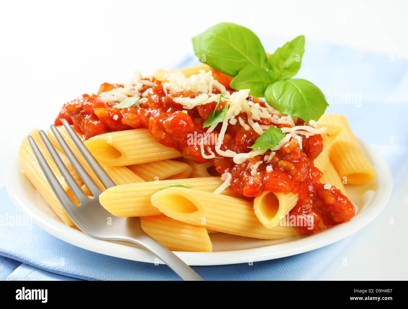 Penne pasta with meat-based tomato sauce and cheese Stock Photo - Alamy