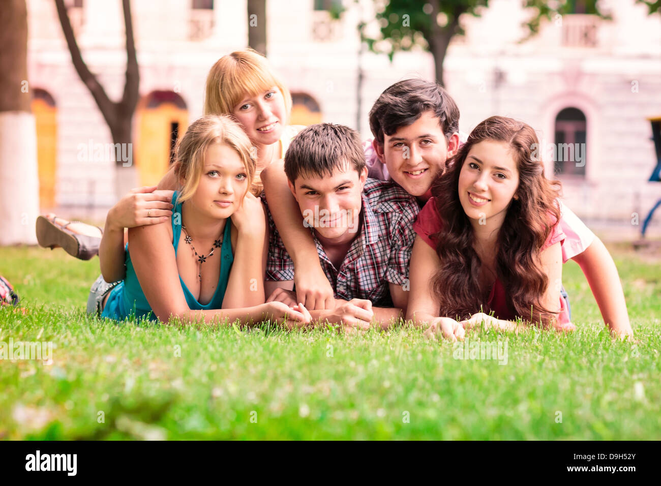 Group of happy smiling Teenage Students Outside Stock Photo - Alamy