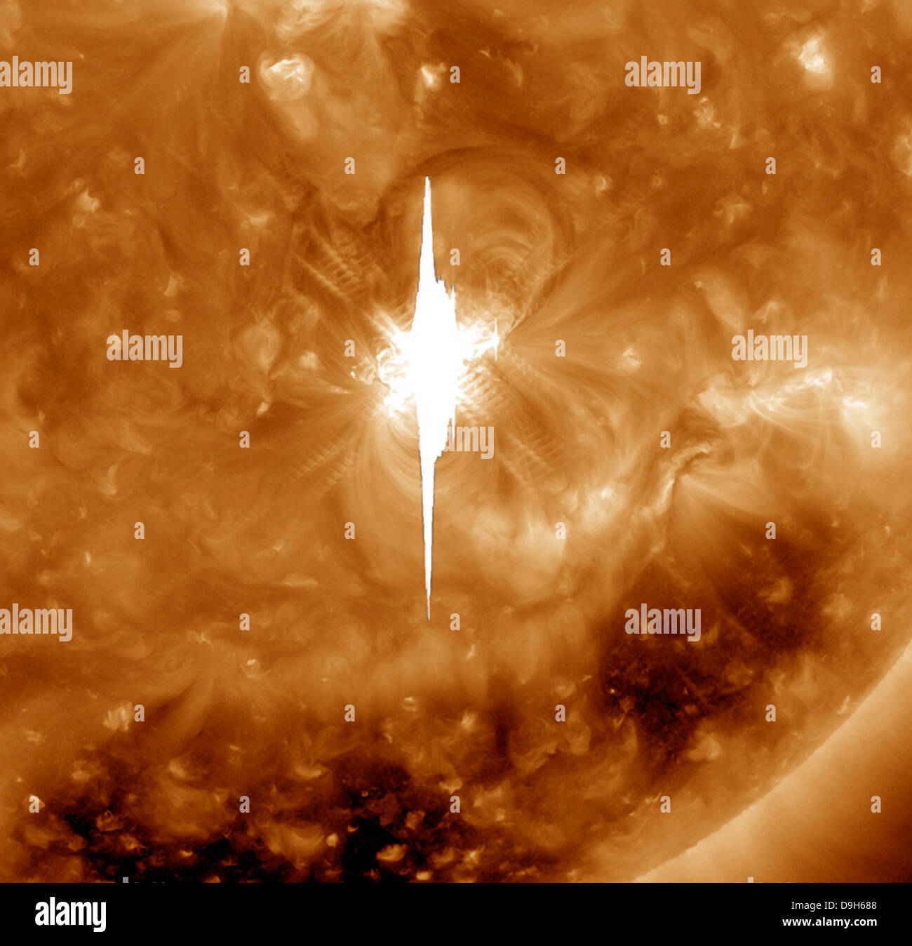 Close-up view of a massive X2.2 solar flare erupts on the Sun. Stock Photo