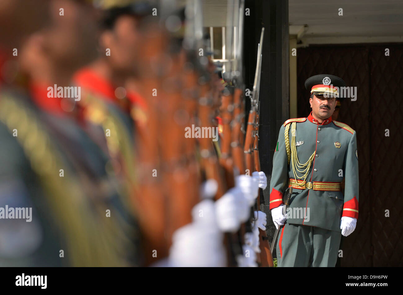 An Afghan officer checks the order of his honor guard as he prepares for the arrival of Deputy Secretary of Defense Ashton Carter at the Ministry of Interior May 12, 2013 in Kabul, Afghanistan. Stock Photo