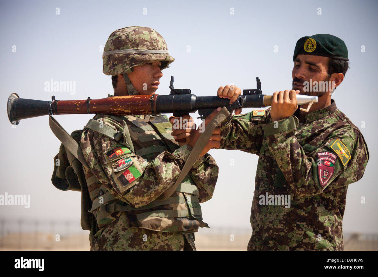 An Afghan National Army soldier with the Kandak Special Operations forces prepares to fire a RPG-7 rocket-propelled grenade launcher during a live-fire exercise May 20, 2013 in Camp Shorabak, Afghanistan. Stock Photo