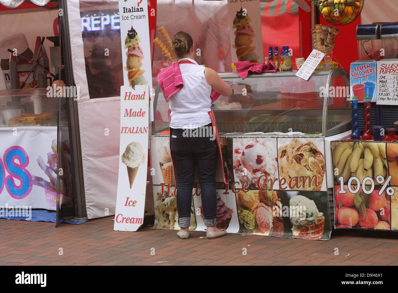 Ice cream sell cleaning her glass unit, Busy street life on The High