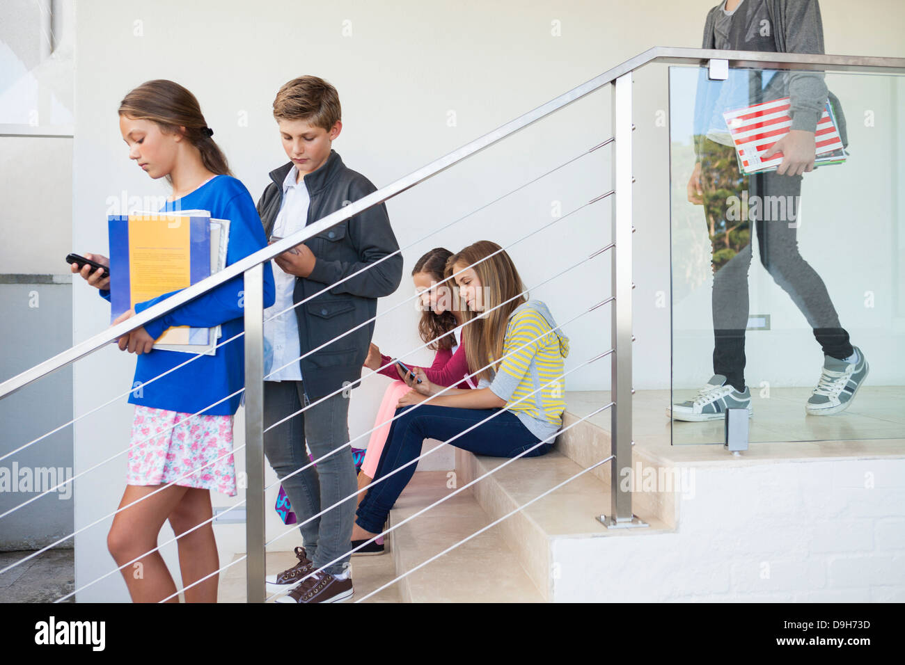 Students using electronic gadget in a school Stock Photo Alamy