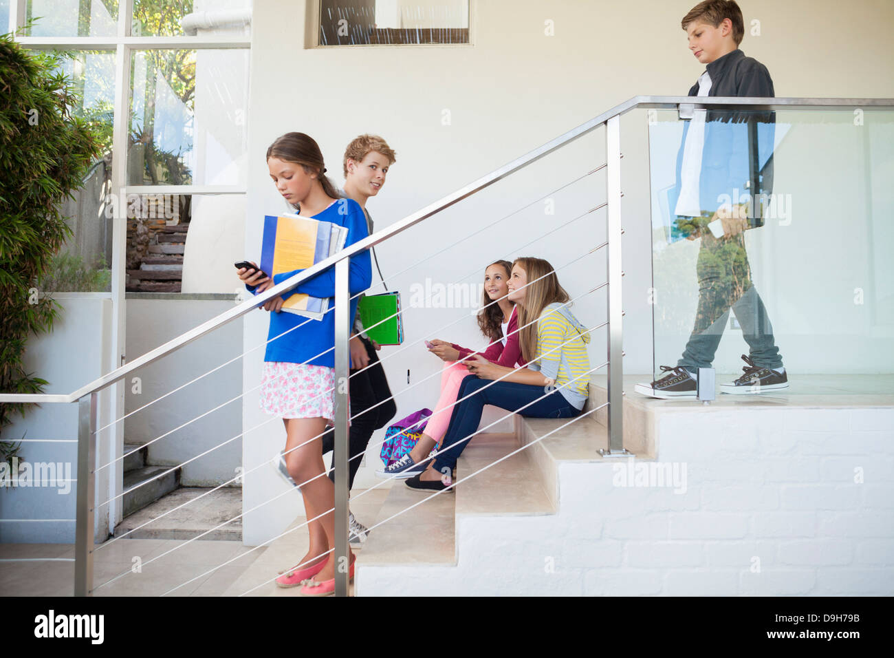 Students using electronic gadget in a school Stock Photo Alamy