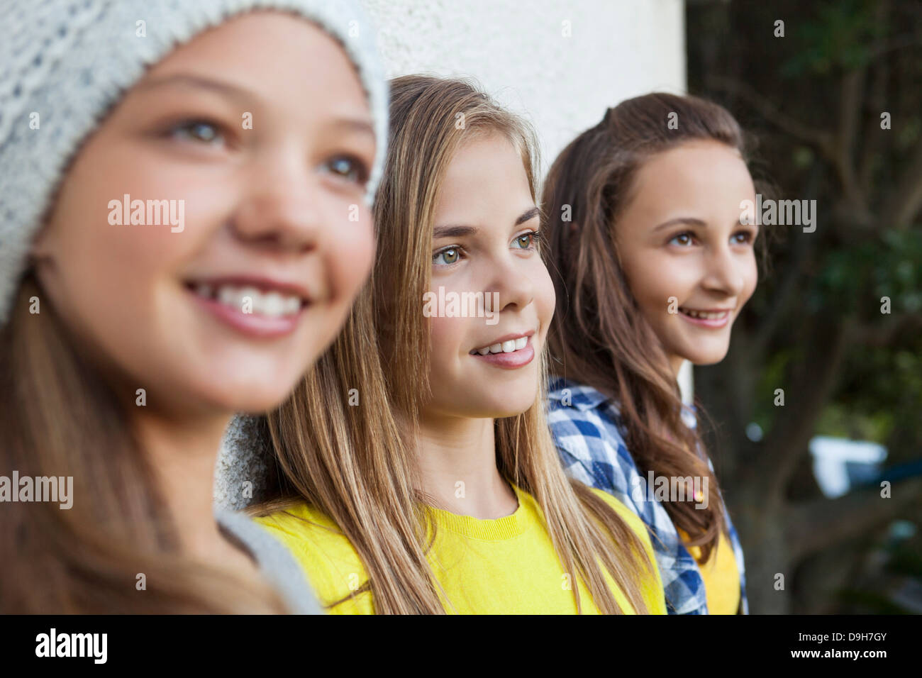 Close-up of three girls smiling together Stock Photo - Alamy