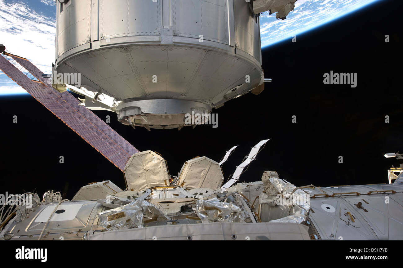 The Permanent Multipurpose Module in the grasp of Canadarm2. Stock Photo