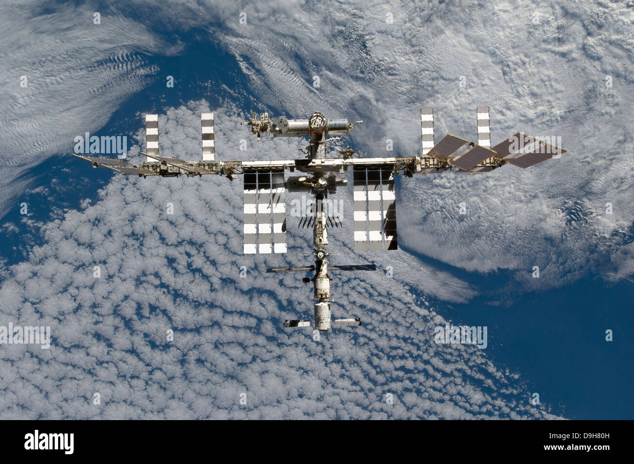 March 7, 2011 - The International Space Station backgropped by a blue and white Earth. Stock Photo