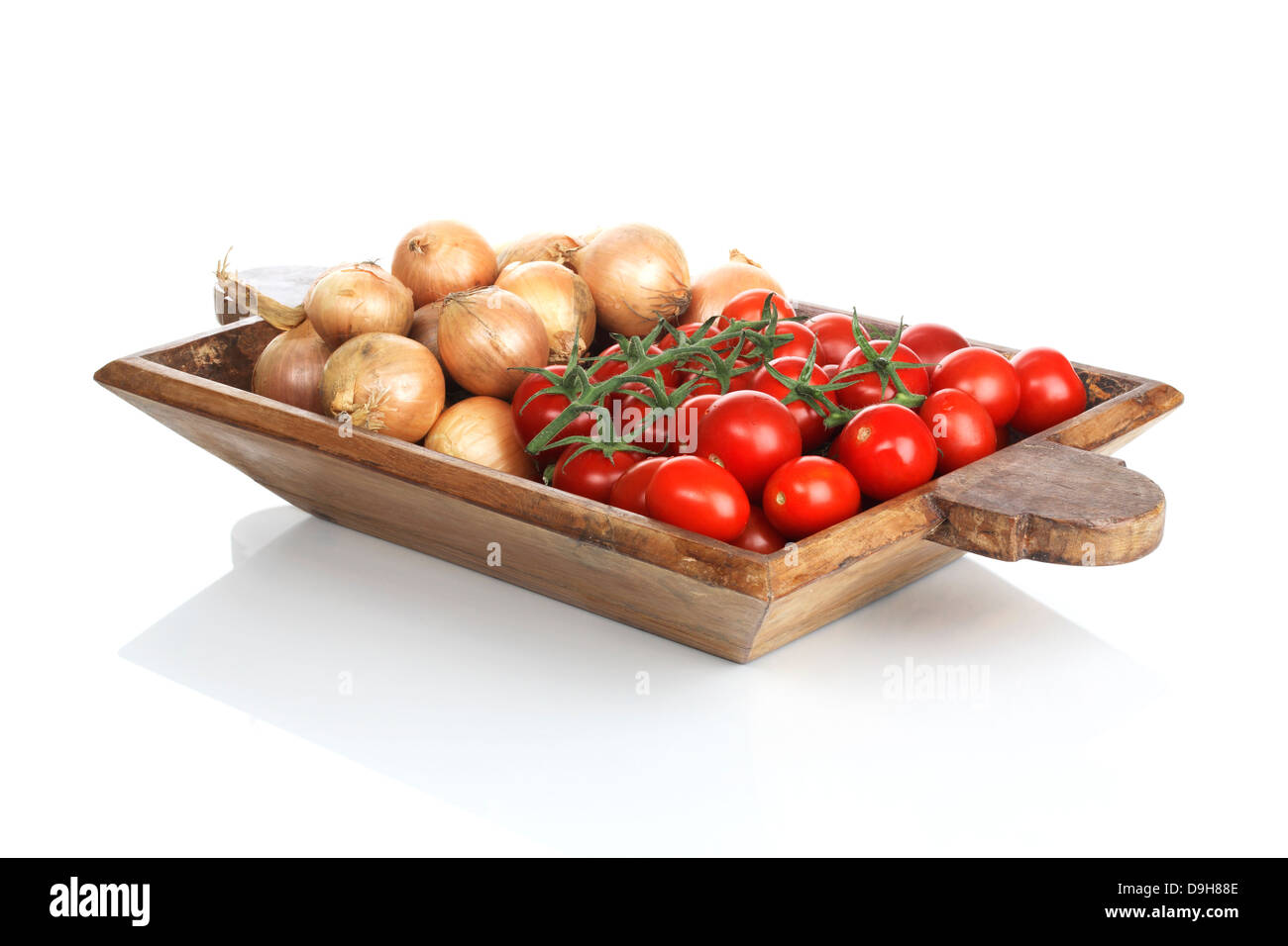 Wooden bowl with tomatoes Stock Photo - Alamy