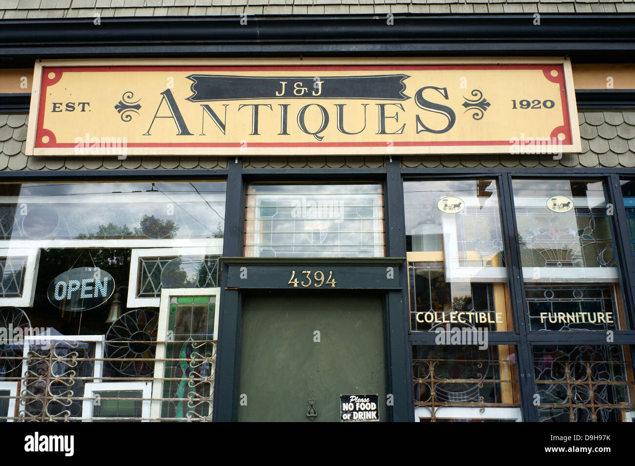 Facade and sign of an antiques store on Main Street, Vancouver, BC