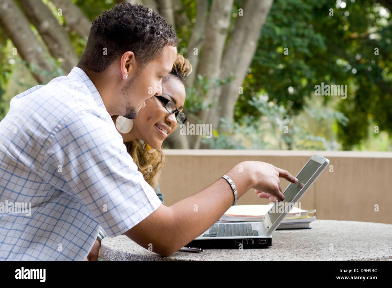 two African American university students using laptop computer Stock ...