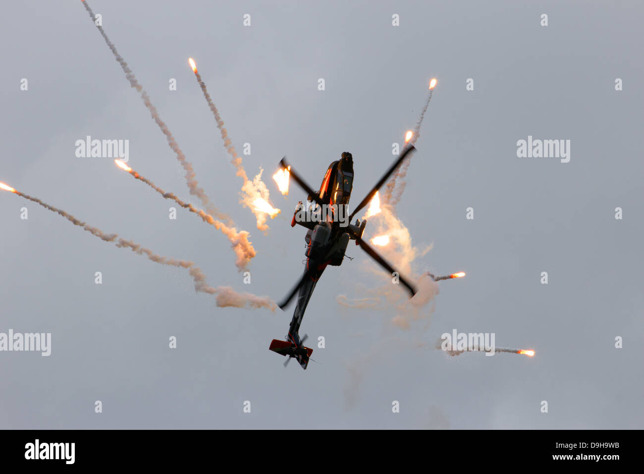 AH-64 Apache attack helicopter firing flares Stock Photo